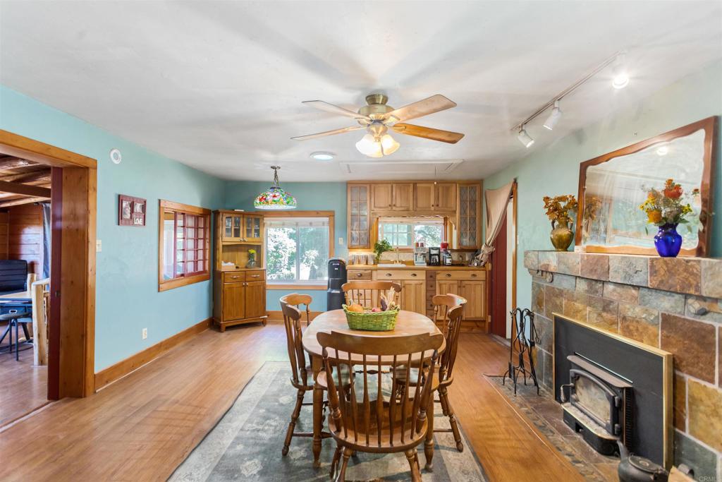 32787 Birch Hill Road Palomar Mountain, CA 92060 - Photo 16 of 44 a view of a dining room with furniture window and wooden floor