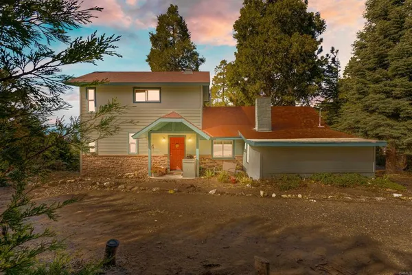 a front view of a house with yard