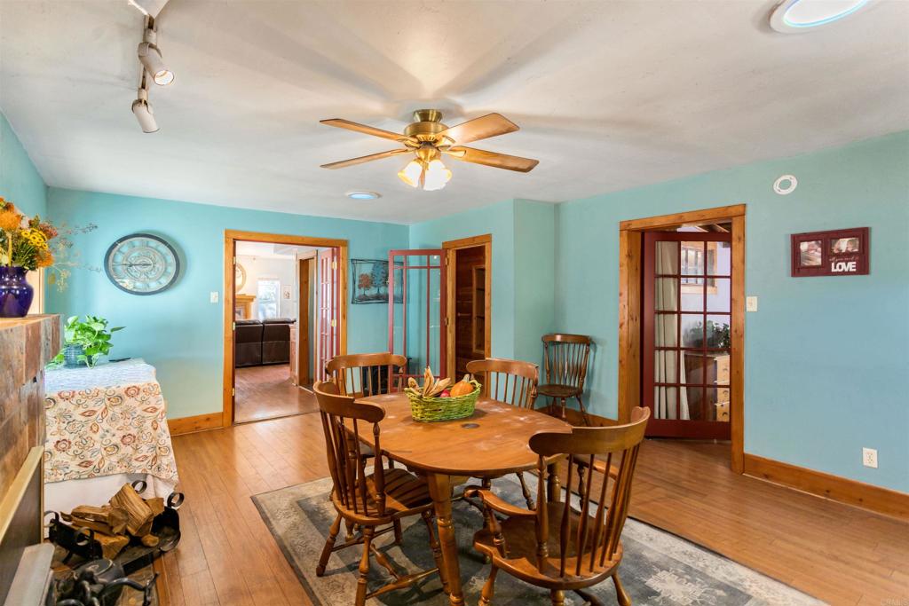 32787 Birch Hill Road Palomar Mountain, CA 92060 - Photo 21 of 44 a view of a dining room with furniture window and wooden floor