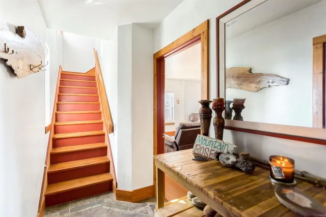 a bathroom with a tub and glass window