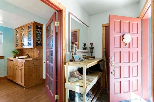 a living room with furniture a fireplace and a window
