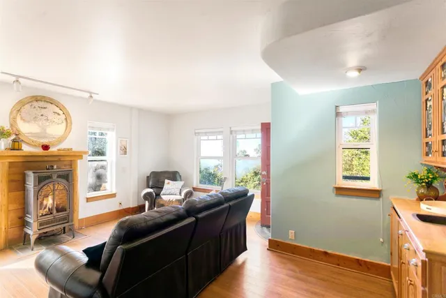 a living room with furniture and a clock