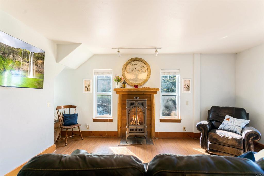 32787 Birch Hill Road Palomar Mountain, CA 92060 - Photo 9 of 44 a living room with furniture and a clock