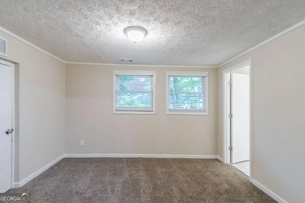 1715 Lee Street Decatur, GA 30035 - Photo 11 of 25 an empty room with windows