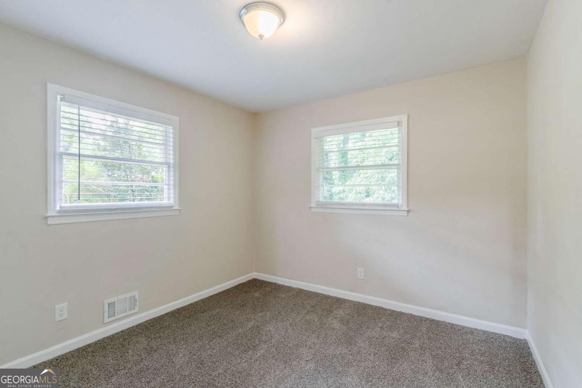 1715 Lee Street Decatur, GA 30035 - Photo 15 of 25 an empty room with a window