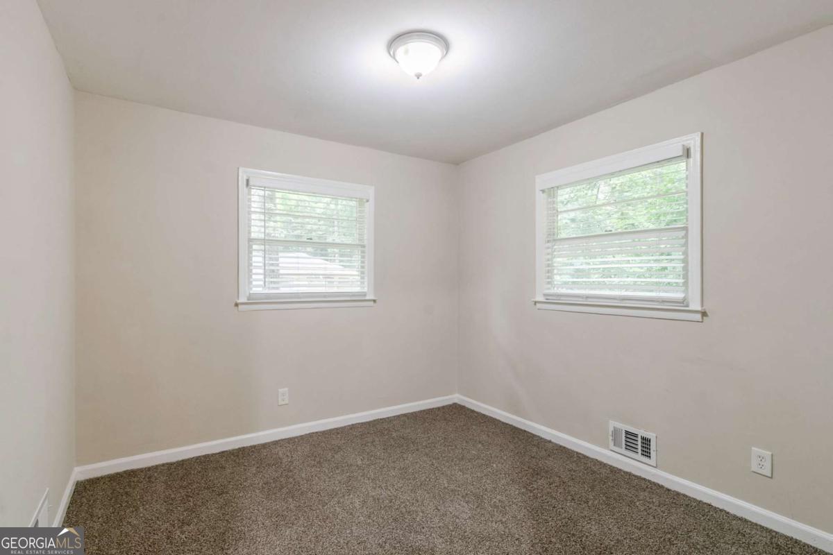 1715 Lee Street Decatur, GA 30035 - Photo 16 of 25 an empty room with a window