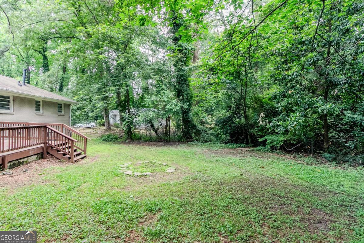 1715 Lee Street Decatur, GA 30035 - Photo 21 of 25 a view of a backyard with a garden and trees