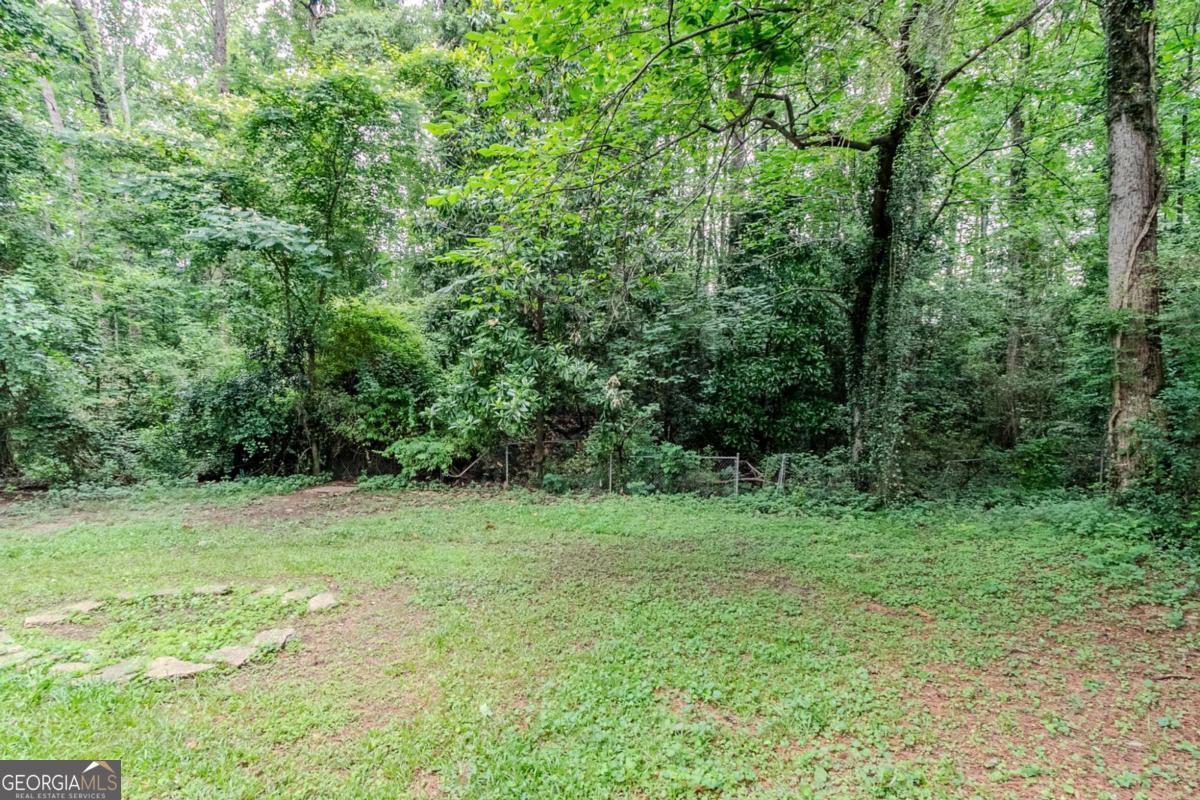 1715 Lee Street Decatur, GA 30035 - Photo 24 of 25 a view of a grassy field with trees in the background