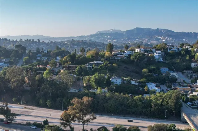 an aerial view of residential house with green space