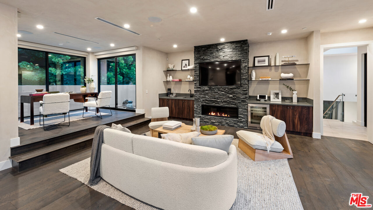 9455 Readcrest Drive Beverly Hills, CA 90210 - Photo 11 of 40 a living room with furniture and a fireplace