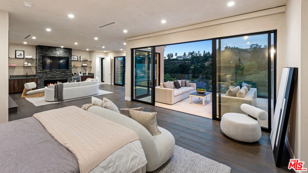 9455 Readcrest Drive Beverly Hills, CA 90210 - Photo 12 of 40 a bedroom with furniture and a large window