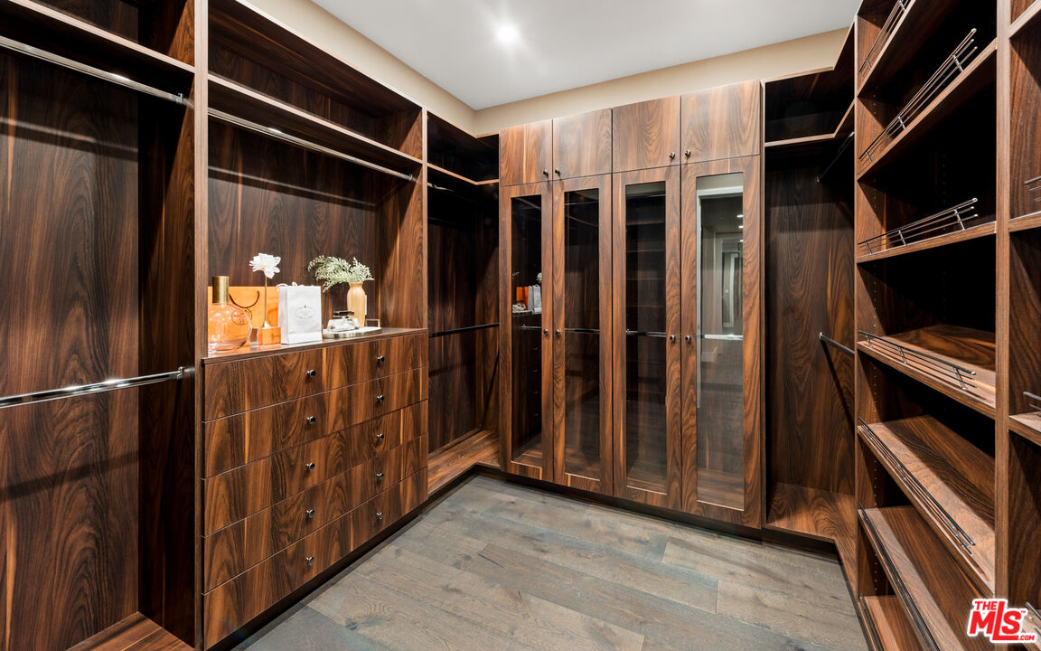 9455 Readcrest Drive Beverly Hills, CA 90210 - Photo 15 of 40 a view of walk in closet with wooden floor
