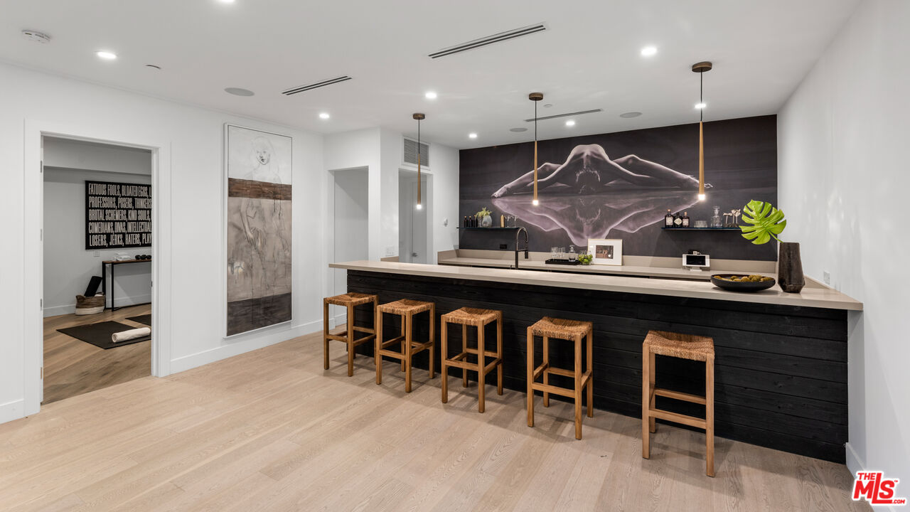 9455 Readcrest Drive Beverly Hills, CA 90210 - Photo 18 of 40 a kitchen with stainless steel appliances granite countertop a sink and a refrigerator
