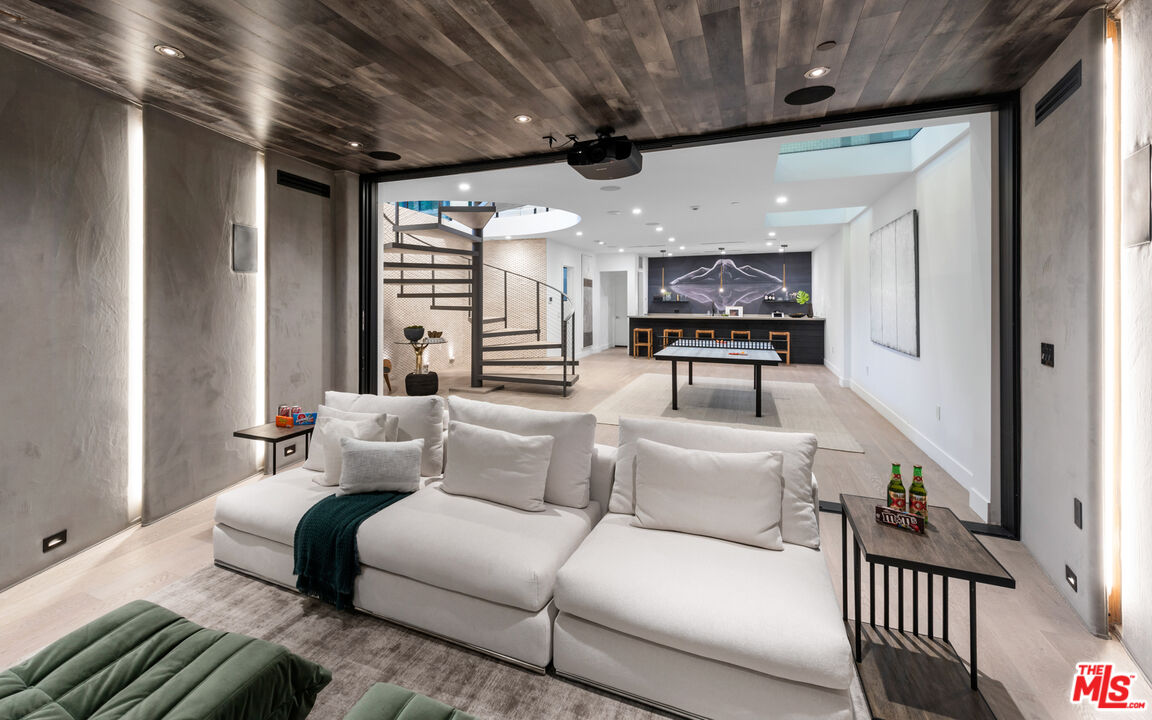 9455 Readcrest Drive Beverly Hills, CA 90210 - Photo 25 of 40 a living room with furniture and a ceiling fan