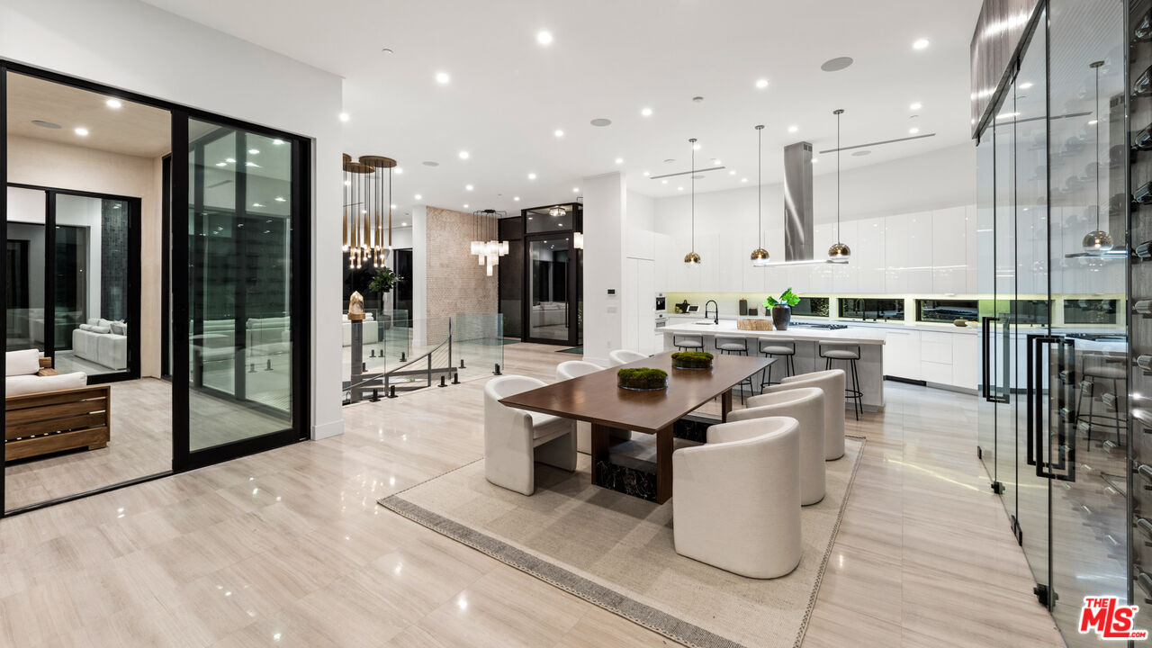 9455 Readcrest Drive Beverly Hills, CA 90210 - Photo 40 of 40 a kitchen with stainless steel appliances kitchen island granite countertop a sink and a refrigerator