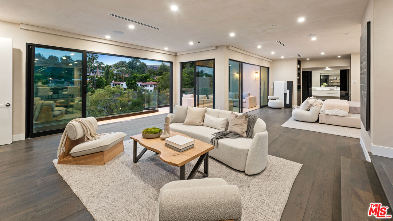 9455 Readcrest Drive Beverly Hills, CA 90210 - Photo 10 of 40 a living room with furniture and a large window