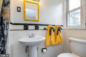 1618 Roundhill Road Baltimore, MD 21218 - Photo 24 of 50 a bathroom with a sink and a mirror