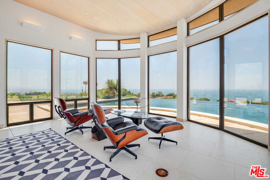 350 Ortega Ridge Road Montecito, CA 93108 - Photo 15 of 39 a living room with furniture and floor to ceiling windows