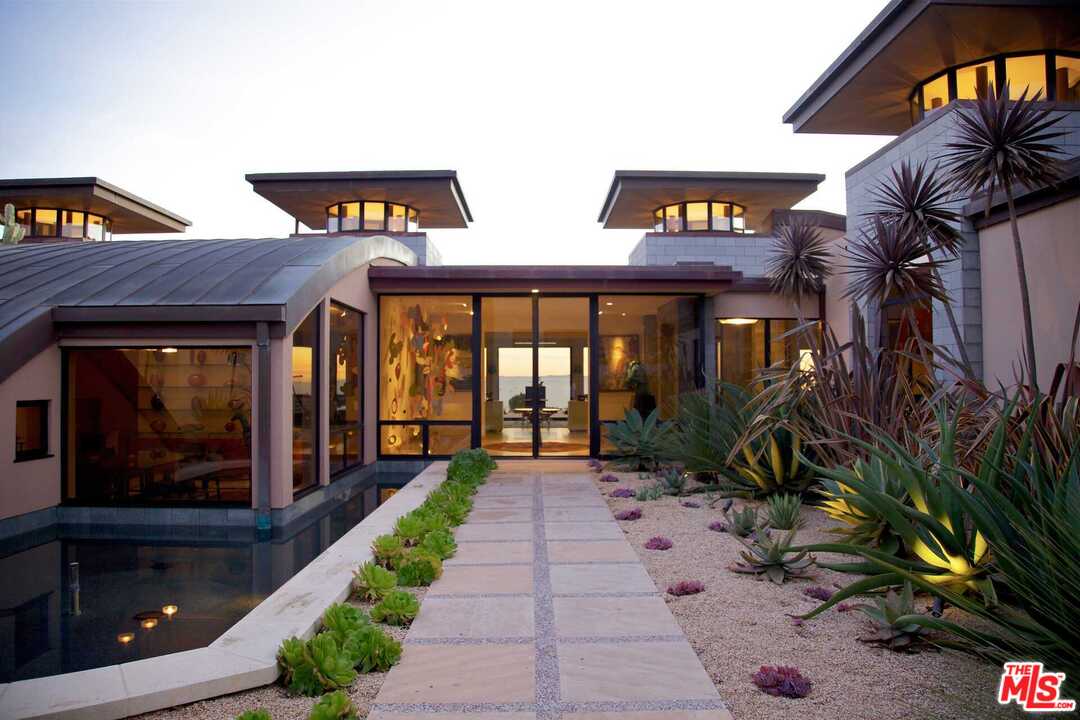 350 Ortega Ridge Road Montecito, CA 93108 - Photo 3 of 39 a view of a building with potted plants