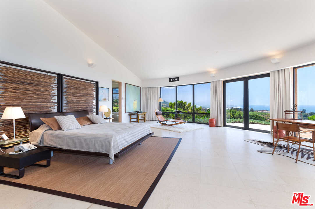 350 Ortega Ridge Road Montecito, CA 93108 - Photo 21 of 39 a living room with furniture and large windows