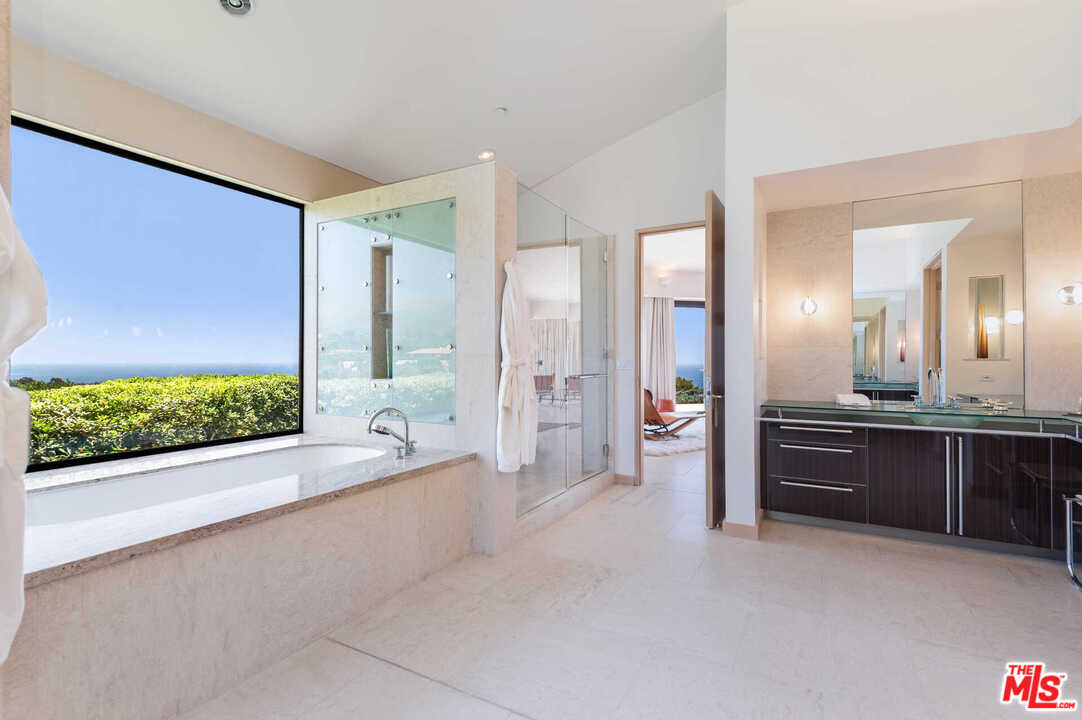 350 Ortega Ridge Road Montecito, CA 93108 - Photo 23 of 39 a large spacious bathroom with a large tub and shower