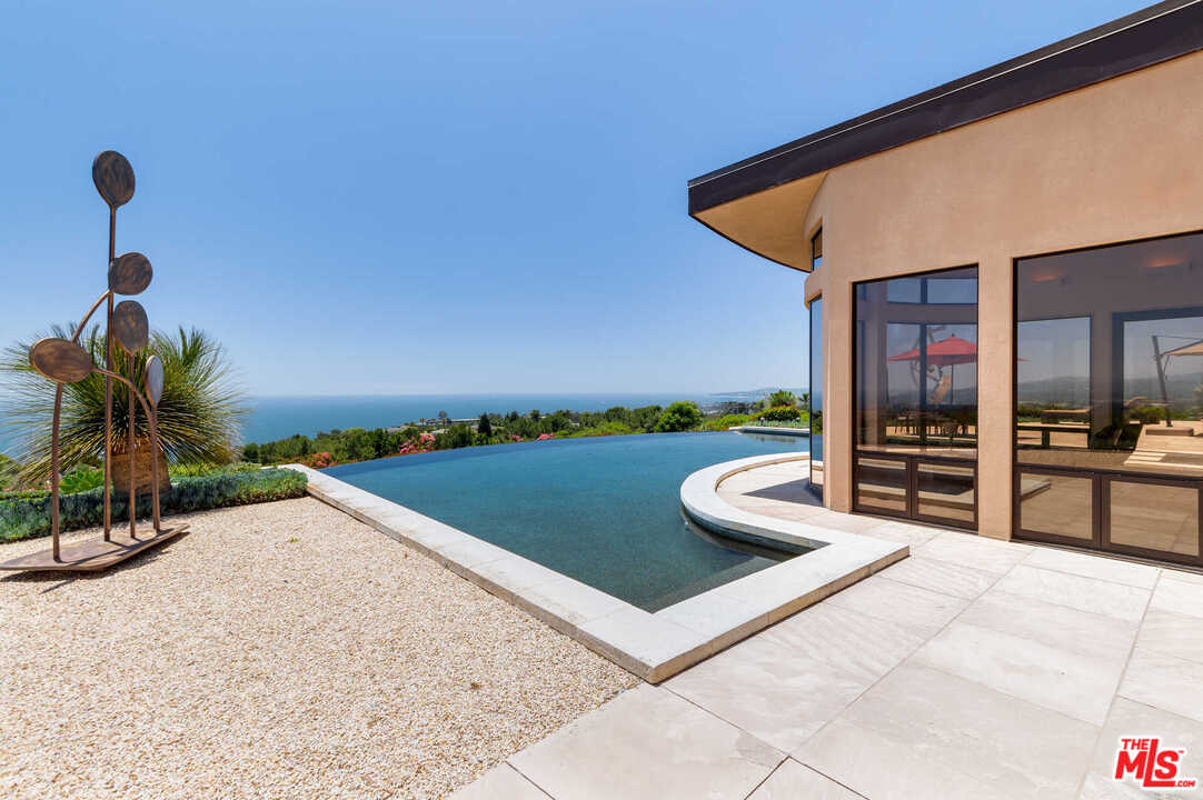 350 Ortega Ridge Road Montecito, CA 93108 - Photo 32 of 39 a view of a backyard with furniture