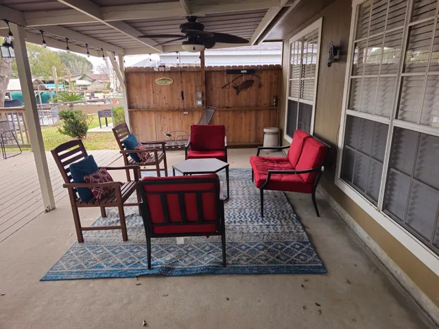 a view of a chairs and table in the window