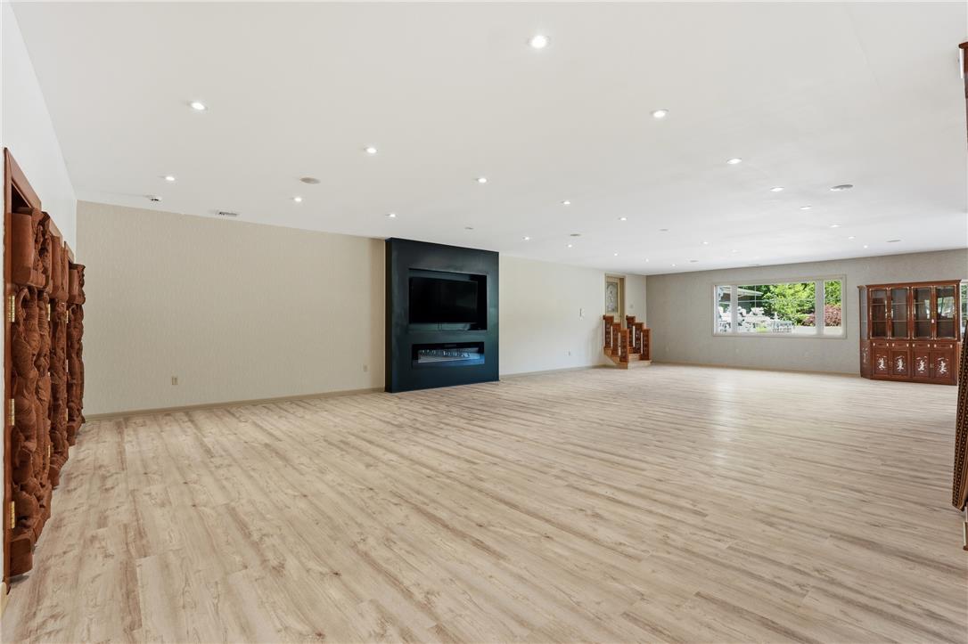 6271 Batman Road Zionsville, PA 18092 - Photo 5 of 100 A spacious lower-level entertainment area boasts recessed lighting and durable laminate flooring.