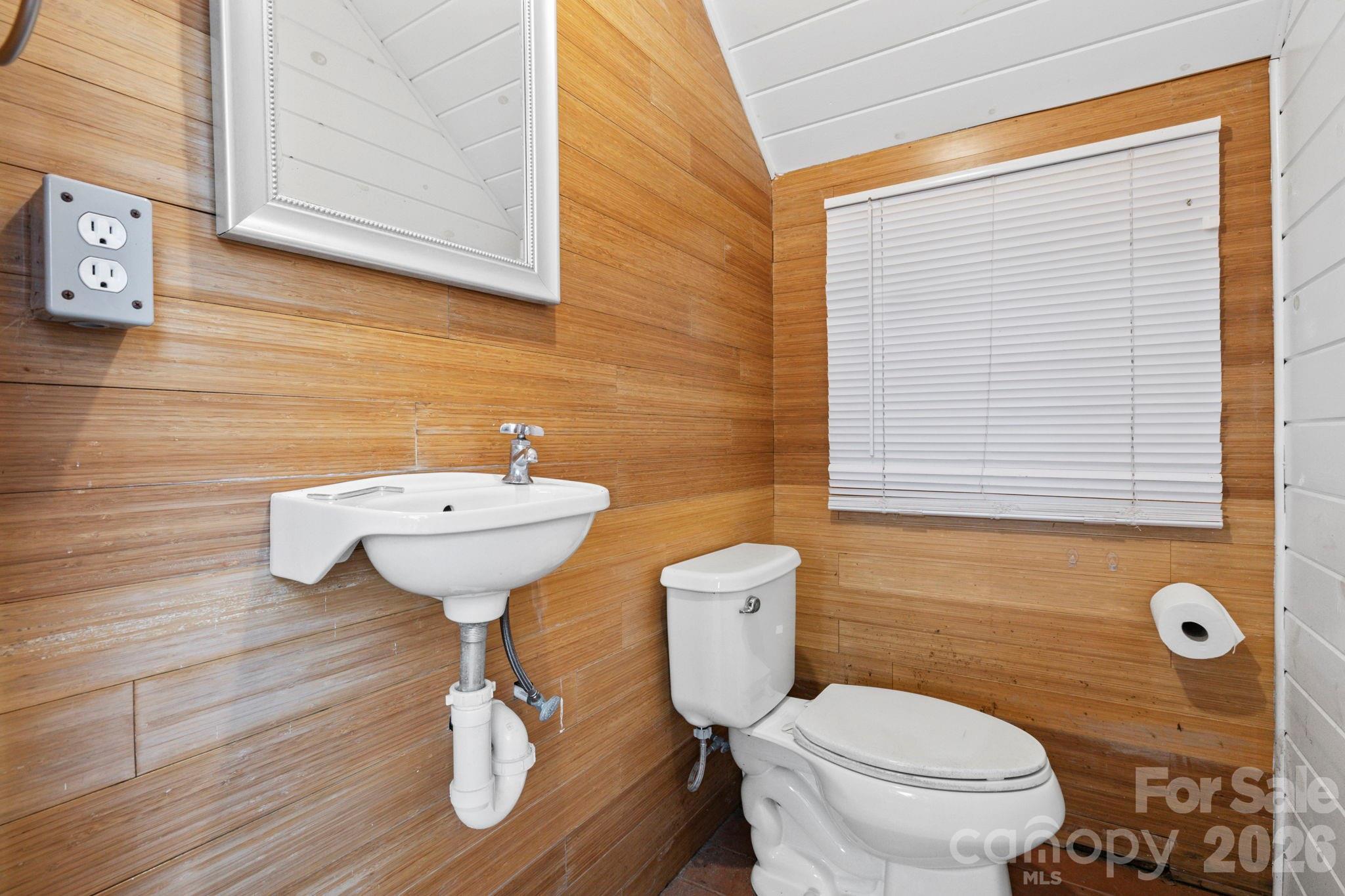 122 Rainbow Drive Murrells Inlet, SC 29576 - Photo 23 of 39 a bathroom with a sink a toilet and mirror