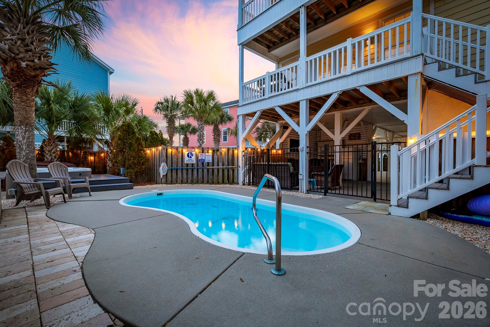 122 Rainbow Drive Murrells Inlet, SC 29576 - Photo 25 of 39 a front view of a house with swimming pool outdoor seating