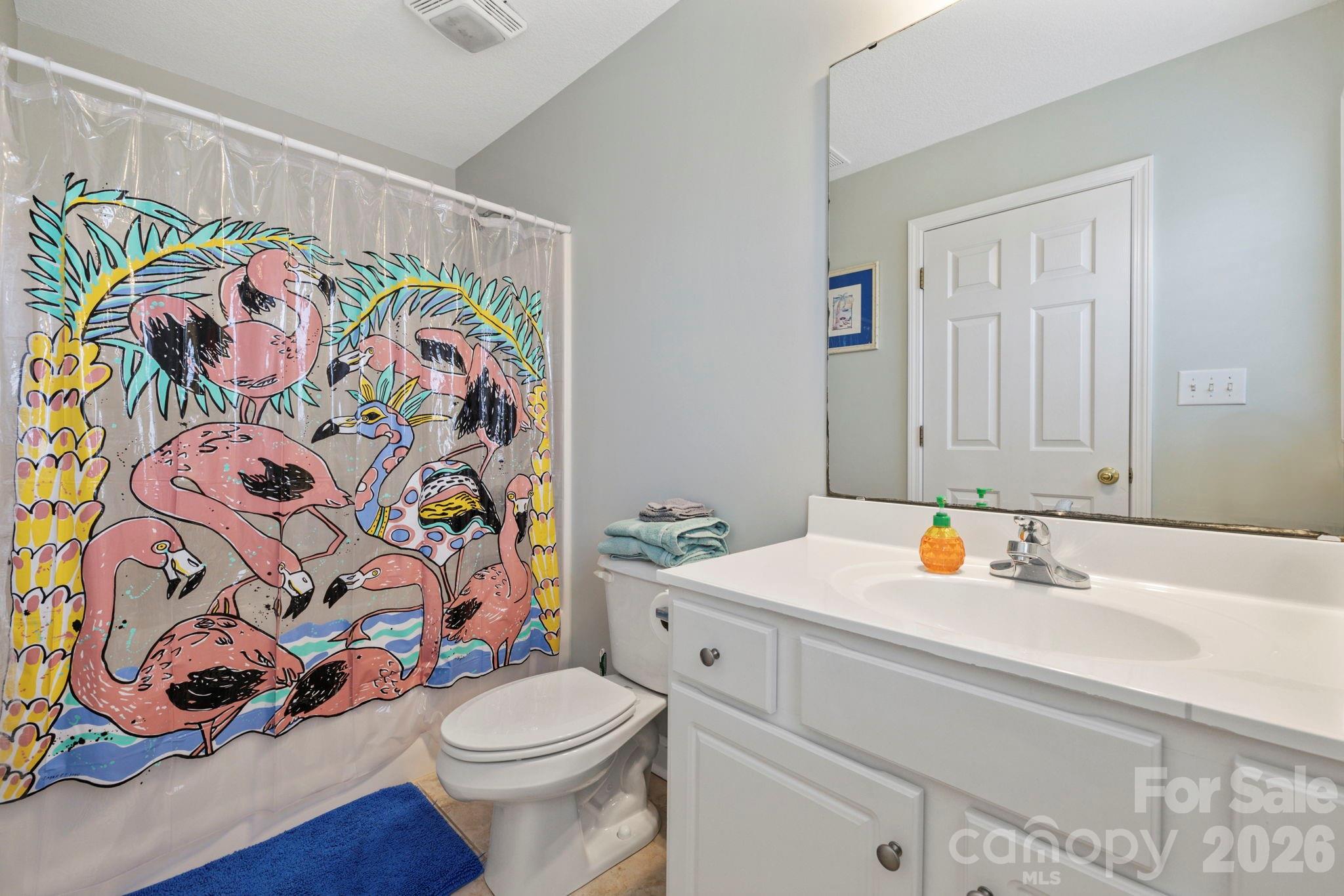 122 Rainbow Drive Murrells Inlet, SC 29576 - Photo 34 of 39 a bathroom with a sink toilet and shower curtain