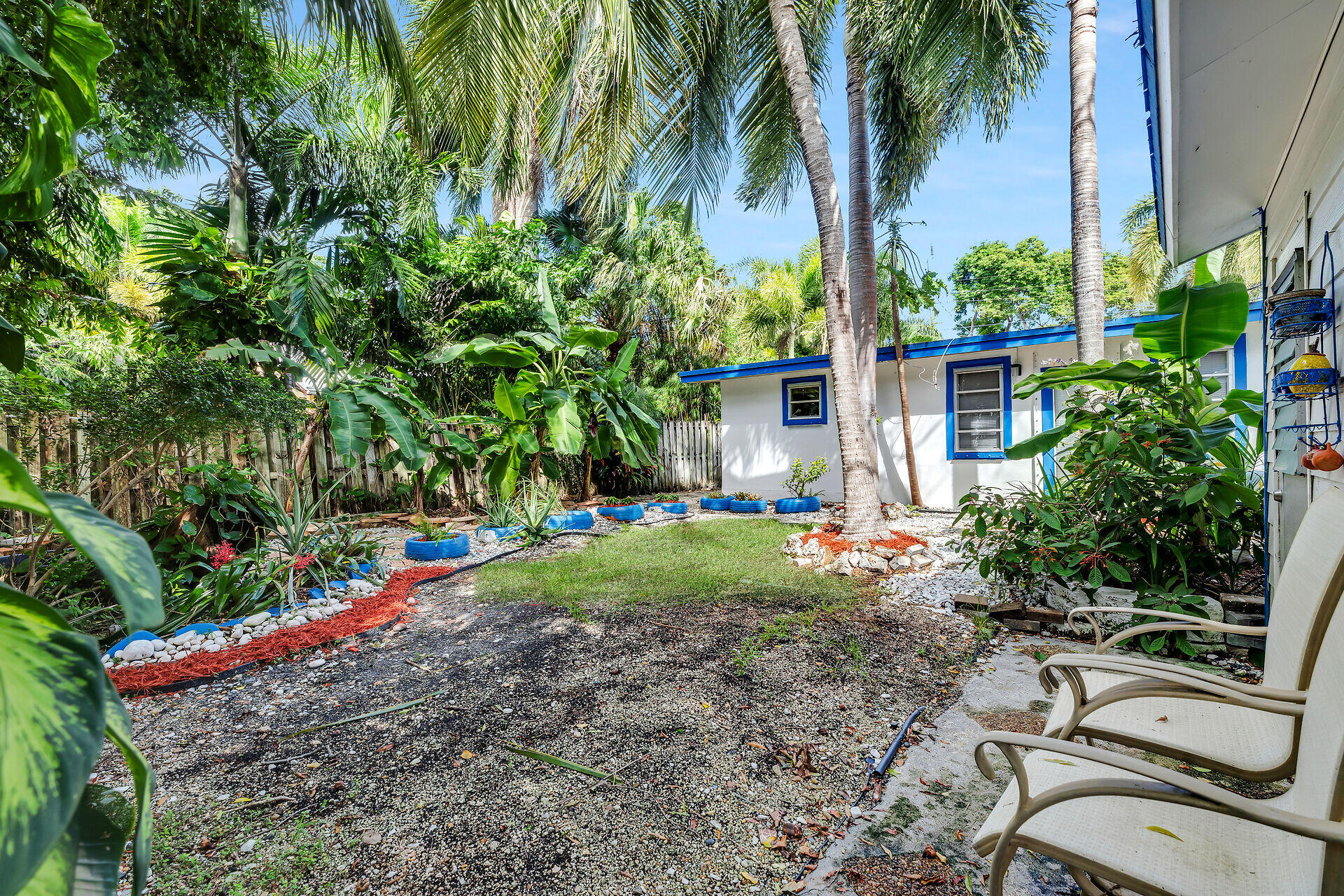 13 Bass Avenue Key Largo, FL 33037 - Photo 31 of 43 a view of a backyard with plants and palm trees