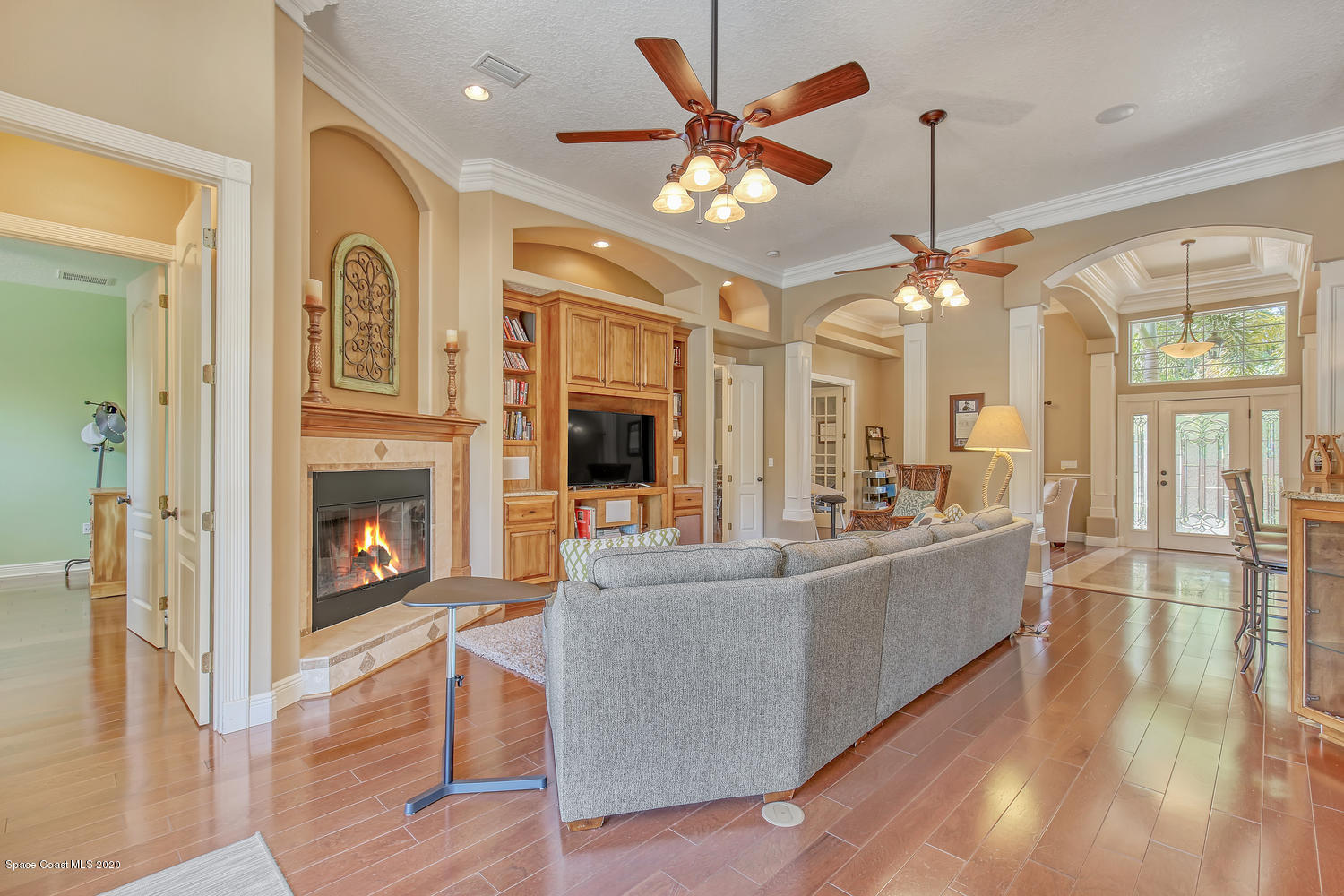 3960 Crooked Mile Road Merritt Island, FL 32952 - Photo 13 of 42 a living room with furniture and a fireplace