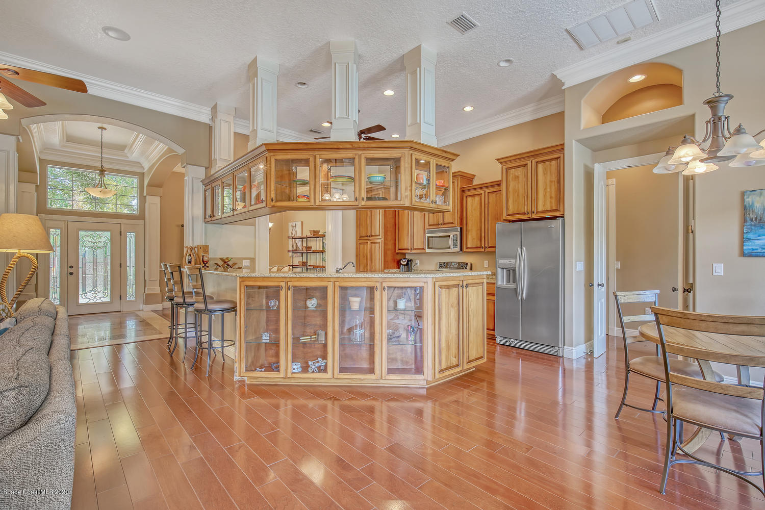 3960 Crooked Mile Road Merritt Island, FL 32952 - Photo 14 of 42 a big room with wooden floor and windows