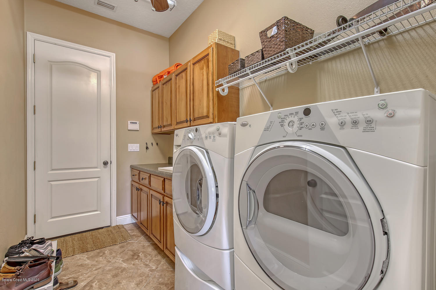 3960 Crooked Mile Road Merritt Island, FL 32952 - Photo 23 of 42 a utility room with dryer and washer