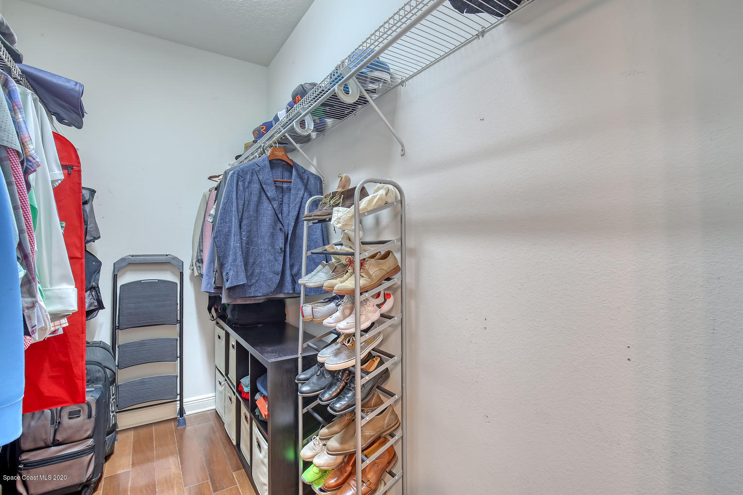 3960 Crooked Mile Road Merritt Island, FL 32952 - Photo 30 of 42 a view of walk in closet with clothes