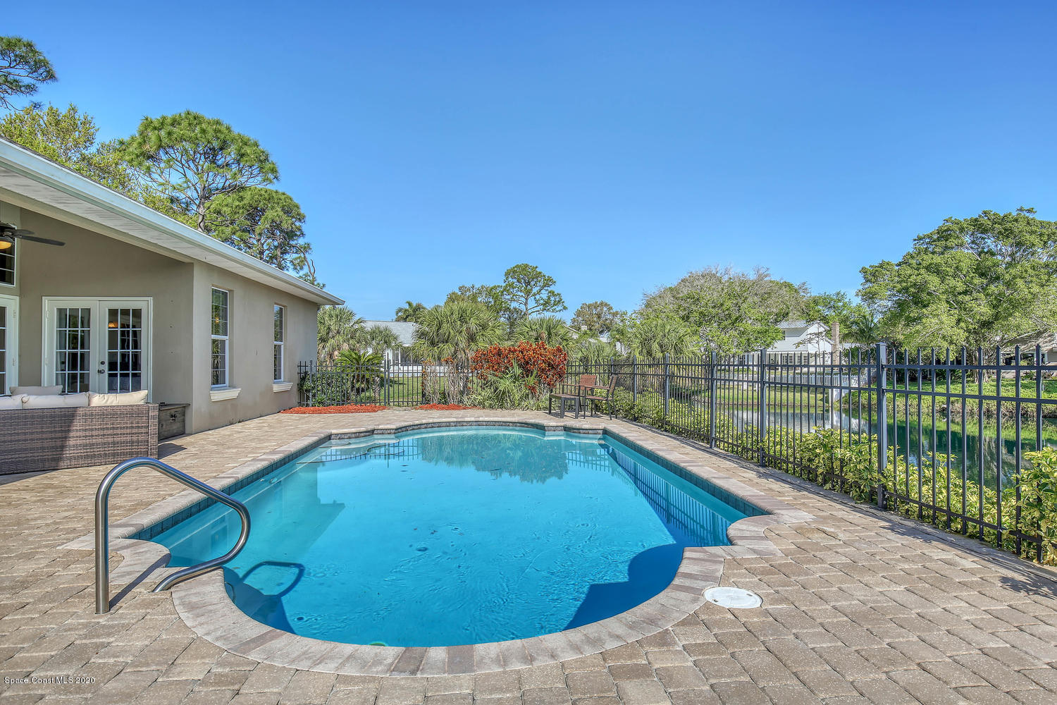 3960 Crooked Mile Road Merritt Island, FL 32952 - Photo 31 of 42 a view of a swimming pool with a lounge chairs