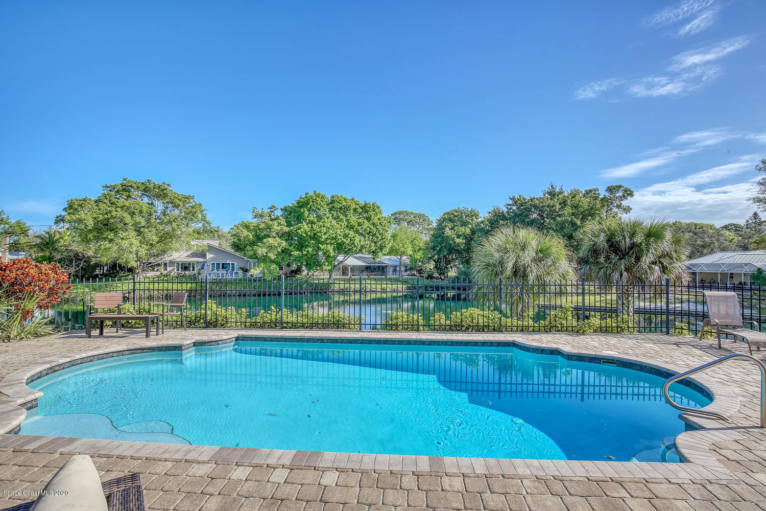 3960 Crooked Mile Road Merritt Island, FL 32952 - Photo 33 of 42 a view of a swimming pool with a yard