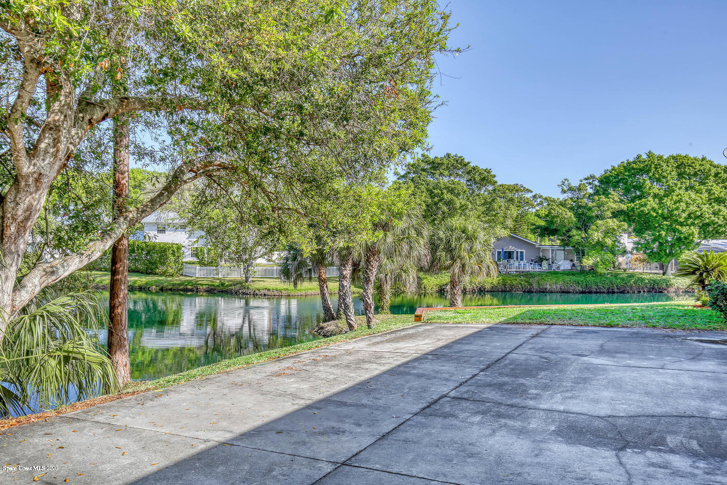3960 Crooked Mile Road Merritt Island, FL 32952 - Photo 36 of 42 a view of lake with a big yard and large trees
