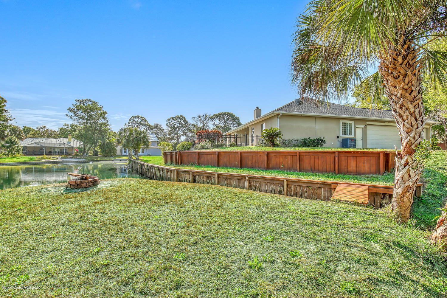 3960 Crooked Mile Road Merritt Island, FL 32952 - Photo 38 of 42 a view of yard with swimming pool and green space