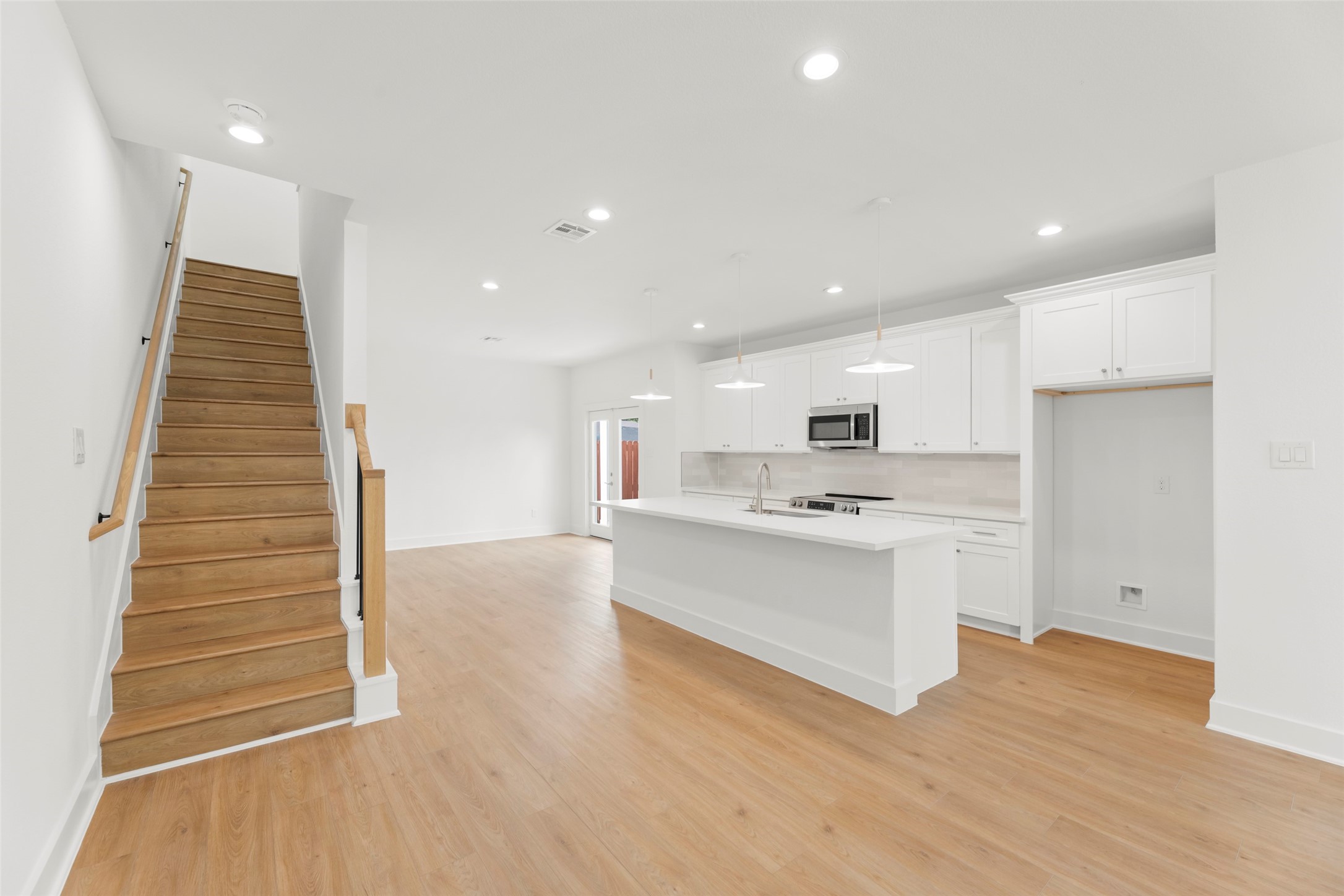 1475 Ferguson Way Houston, TX 77088 - Photo 5 of 27 a view of kitchen with wooden floor and electronic appliances