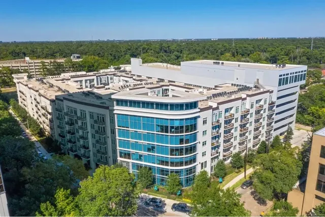 a view of a balcony with a floor to ceiling window next to a building