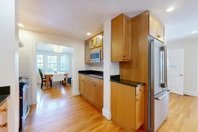 a view of living room with furniture and wooden floor