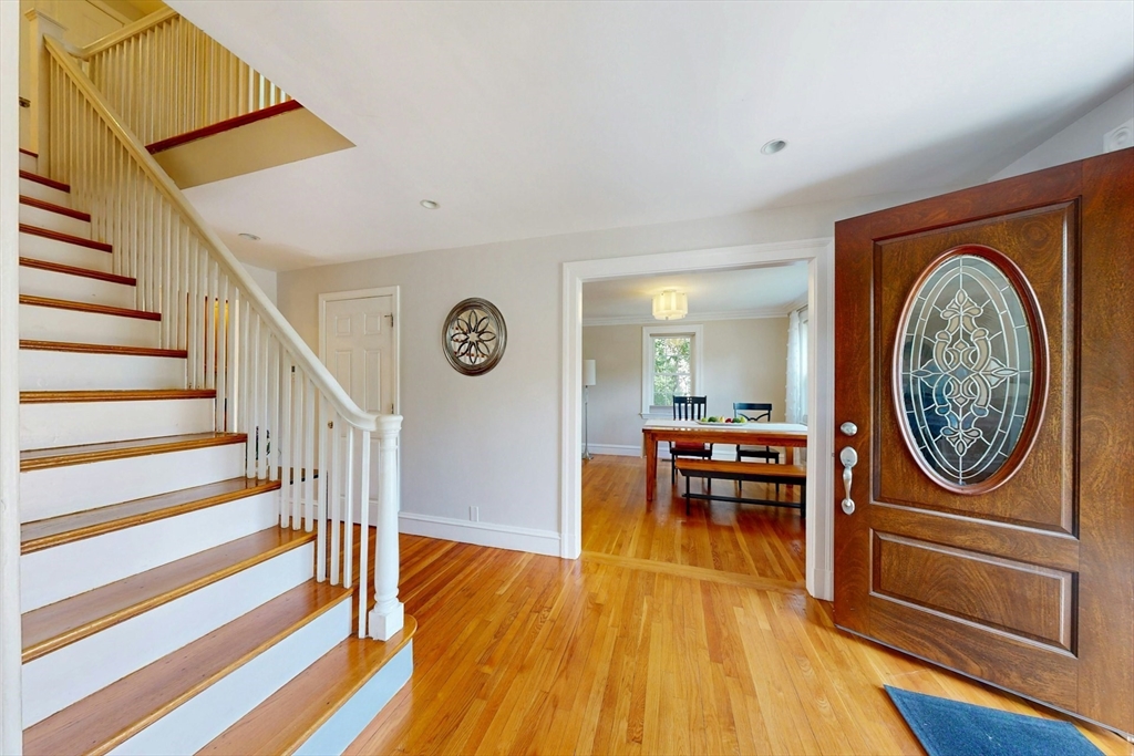 25 Allen Avenue Newton, MA 02468 - Photo 2 of 25 a view of a livingroom with furniture wooden floor clock and stairs