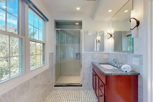 a bathroom with a sink a vanity and a mirror