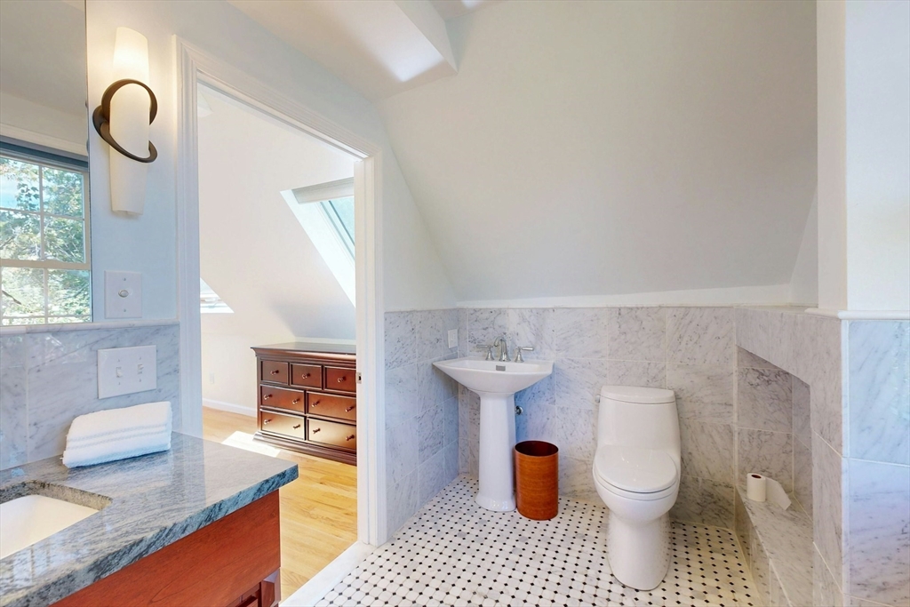 25 Allen Avenue Newton, MA 02468 - Photo 22 of 25 a bathroom with a sink a toilet and shower