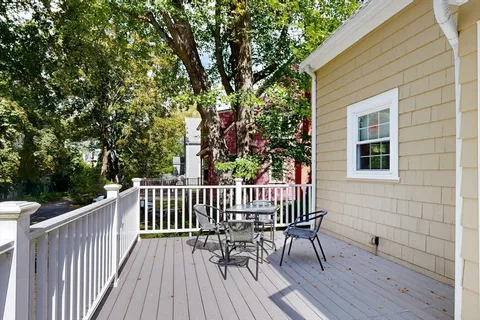 a view of a wooden deck with a bench