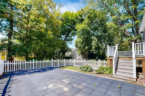 a view of a deck with a small yard