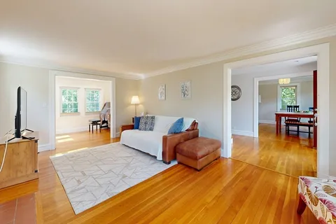 a living room with furniture and a table