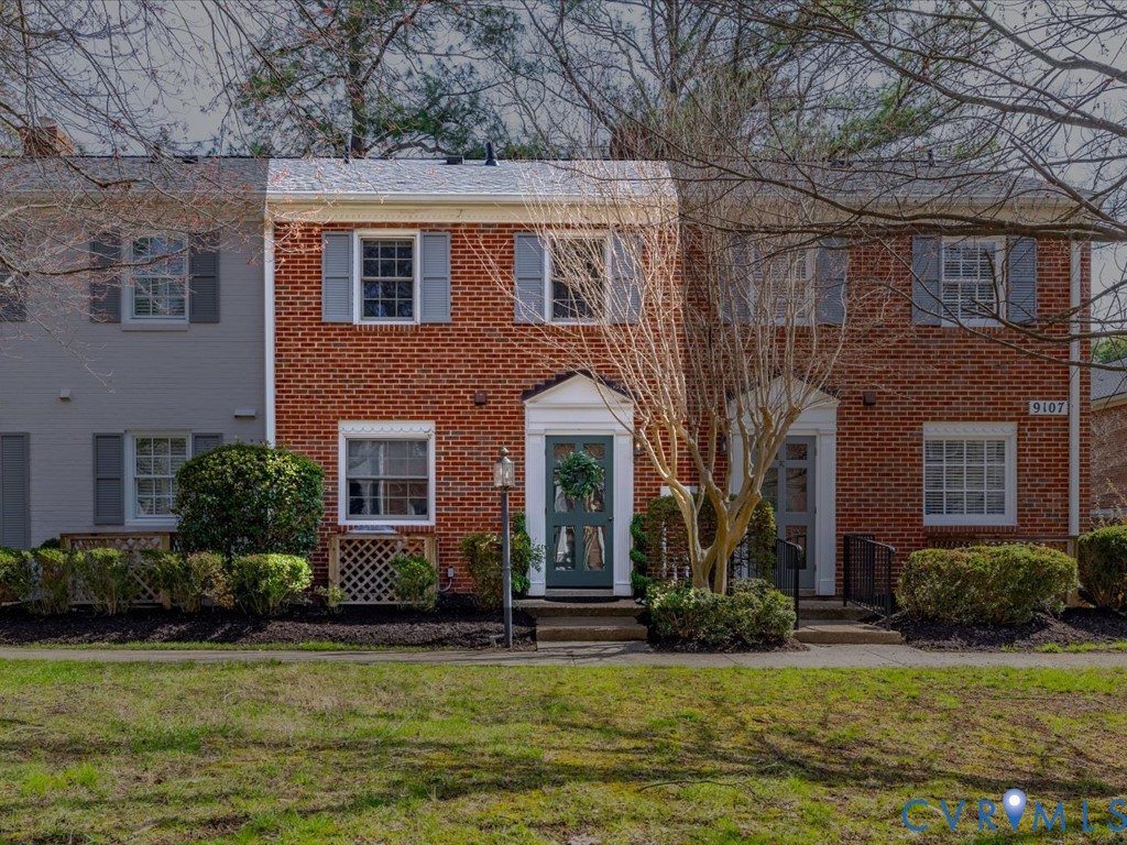9107 Derbyshire Road, Unit J Henrico, VA 23229 - Photo 1 of 38 a front view of a house with a yard